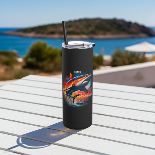 Black birth month travel tumbler with colorful shark design on white outdoor table near sea