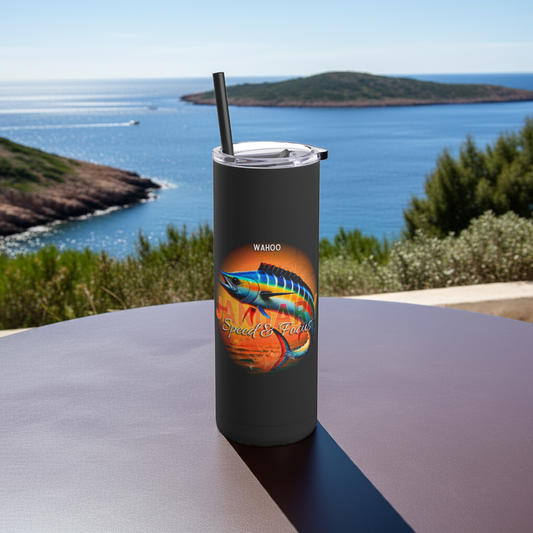 Black birth month travel tumbler featuring a colorful Wahoo fish design on a round table by the sea