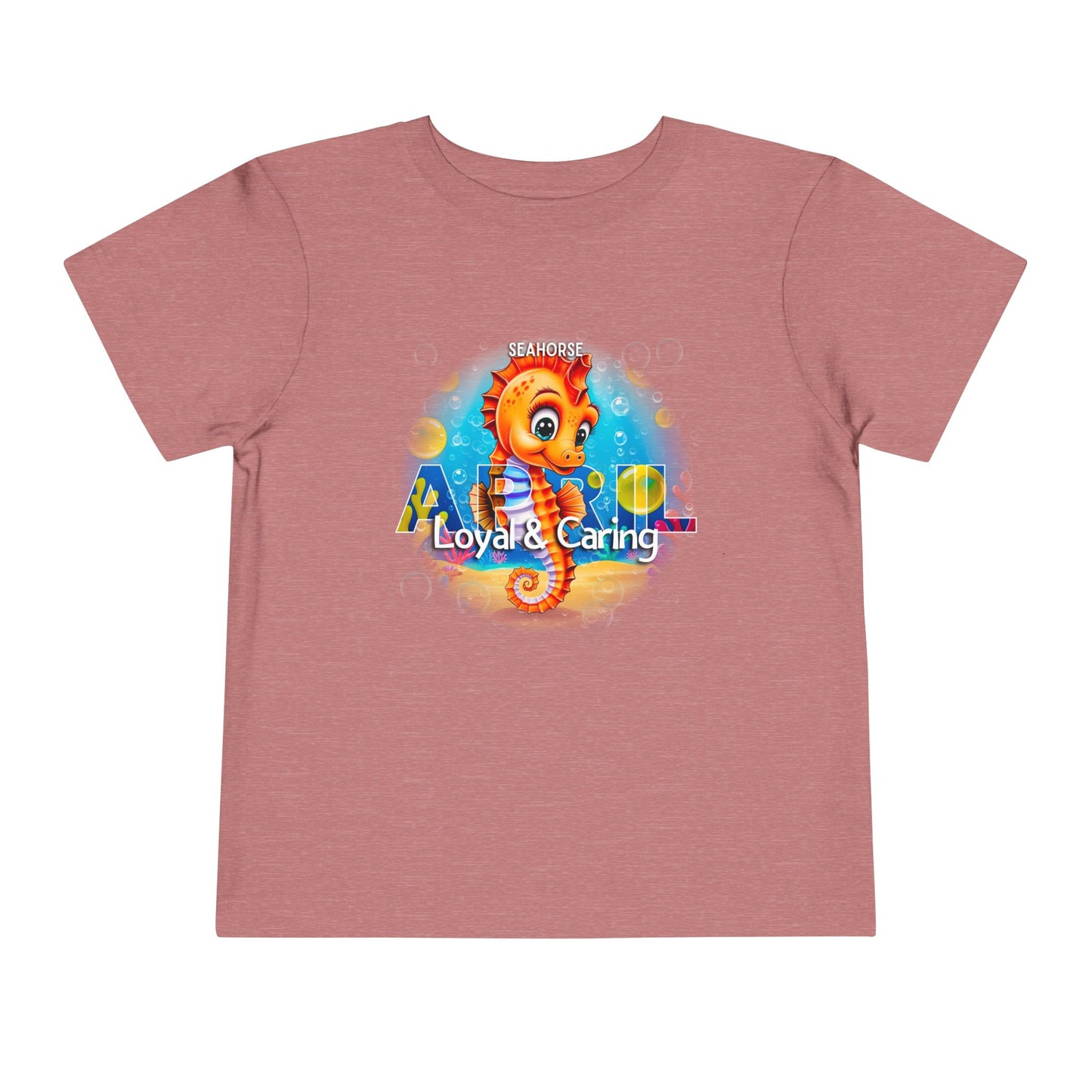 Kids birth month tshirt featuring a colorful seahorse design with Loyal and Caring text