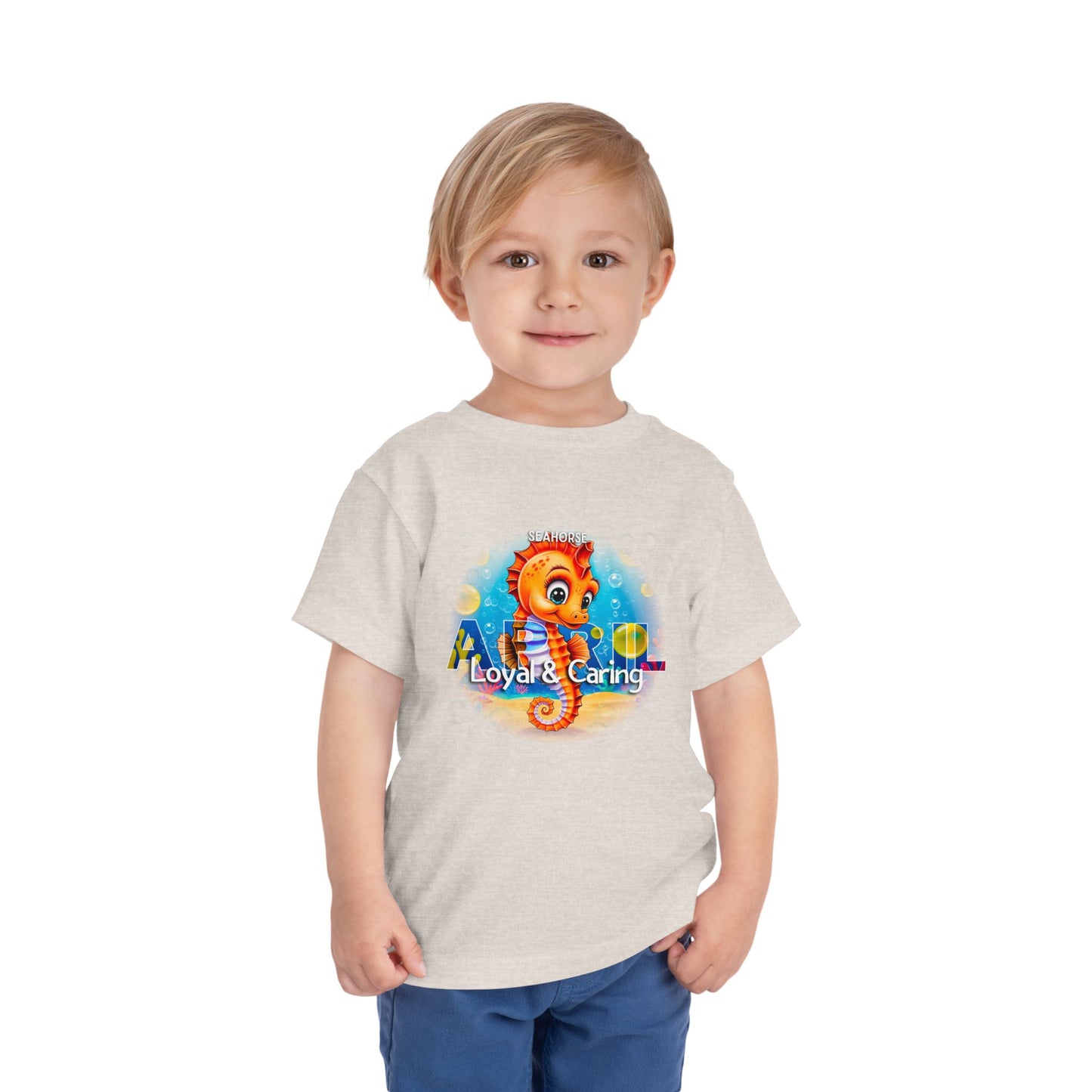 Toddler wearing a kids birth month tshirt with colorful seahorse graphic from kids clothes