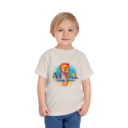 Toddler wearing a kids birth month tshirt with colorful seahorse graphic from kids clothes
