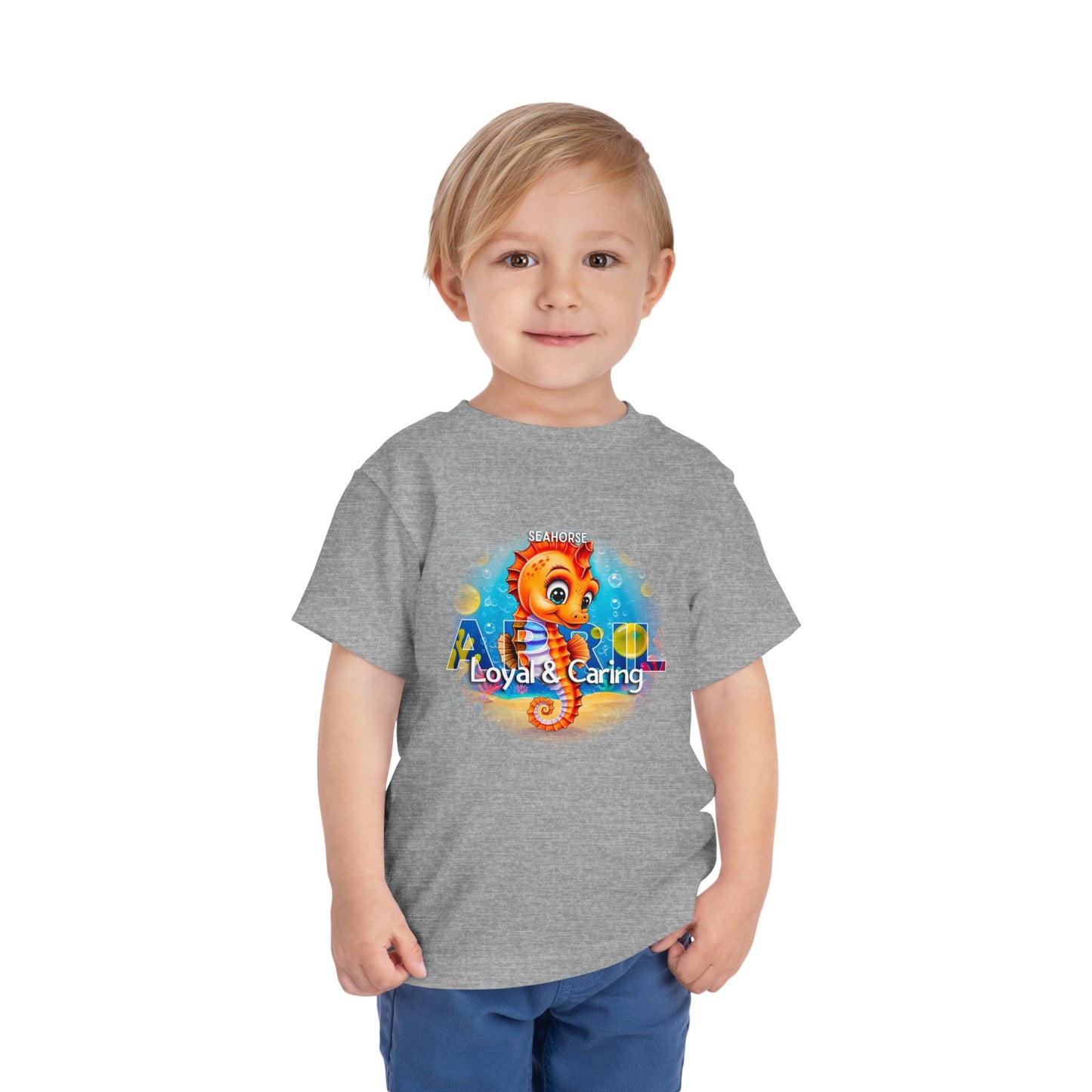 Toddler wearing gray kids birth month tshirt featuring a colorful seahorse design