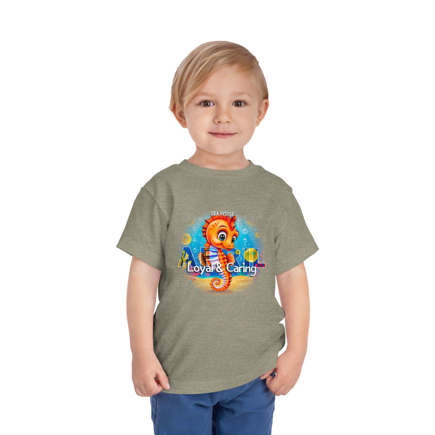 Kids birth month tshirt featuring a colorful seahorse design with loyal and caring traits