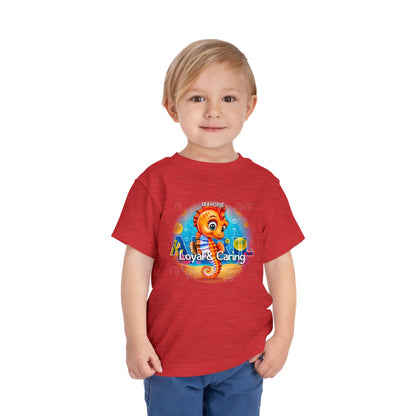 Toddler wearing red kids birth month tshirt featuring a colorful seahorse design with loyal and caring text