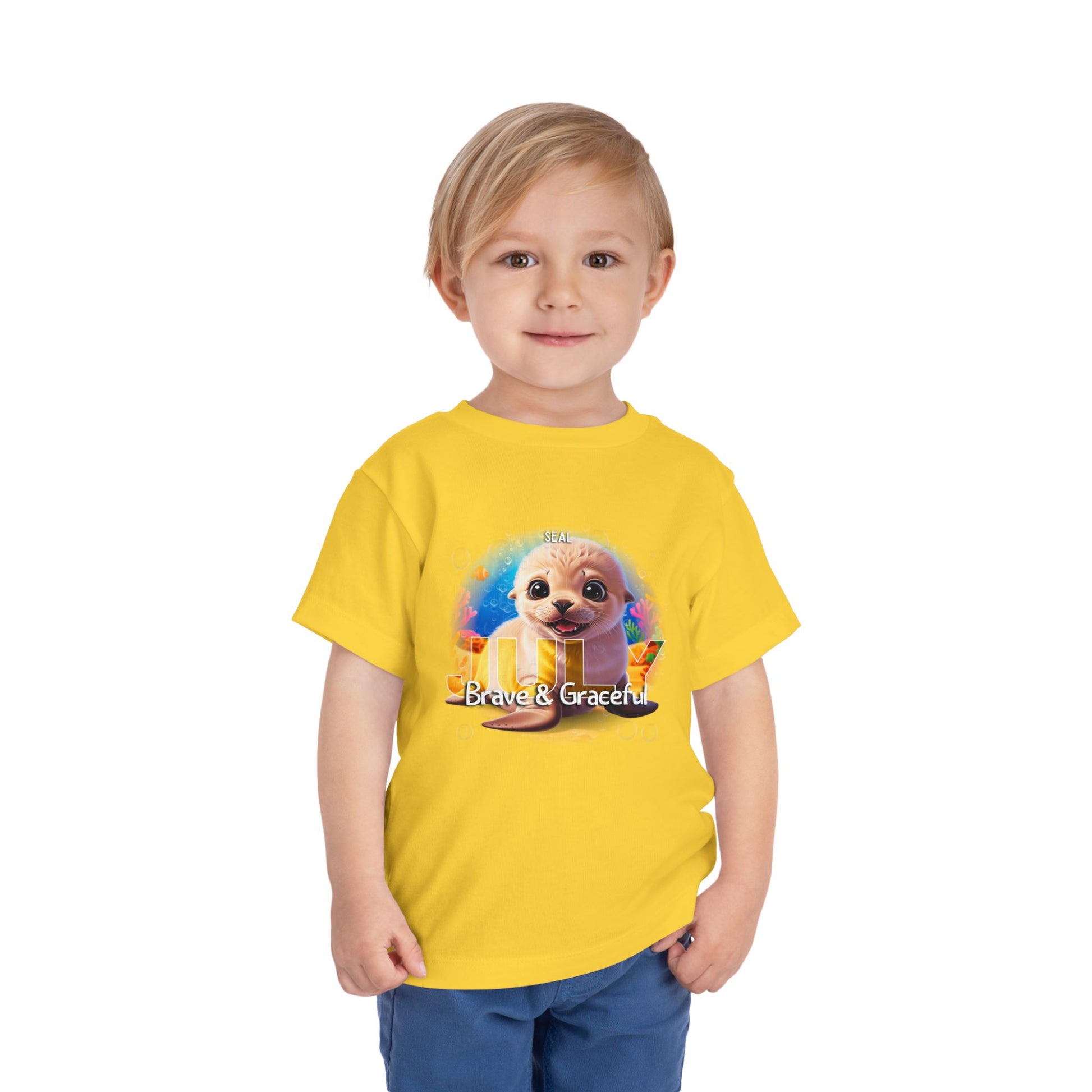 Kids birth month tshirt with cute seal graphic and Brave & Graceful text in yellow kids clothes