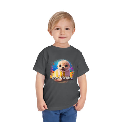 Child wearing a kids birth month tshirt with a cute sea otter design and Brave & Graceful text