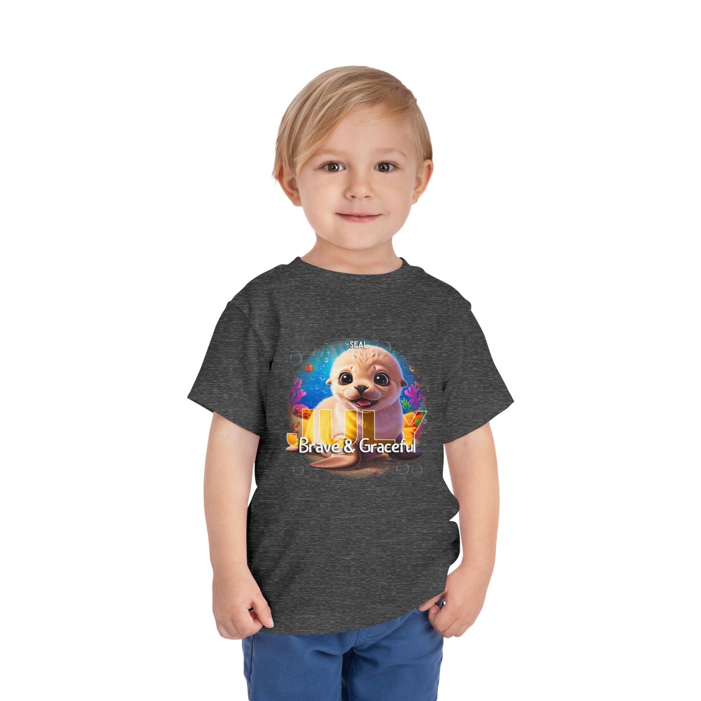 Child wearing a kids birth month tshirt with a cute animal graphic and Brave & Graceful text