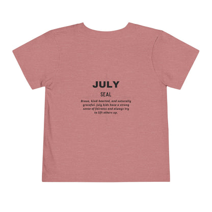 Kids birth month tshirt in pink featuring July Seal design with motivational text on back
