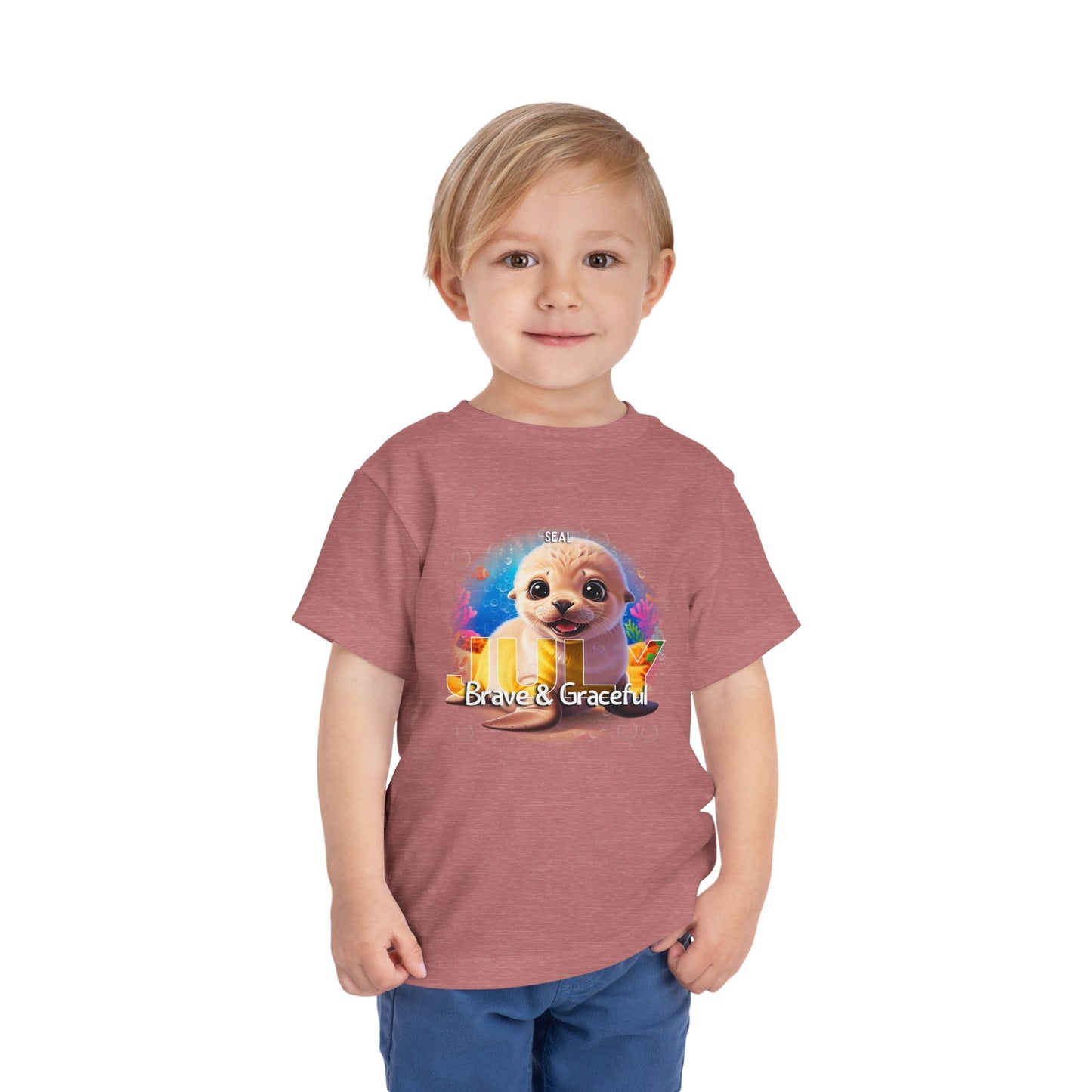 Toddler wearing a kids birth month tshirt with a cute animal and colorful design 