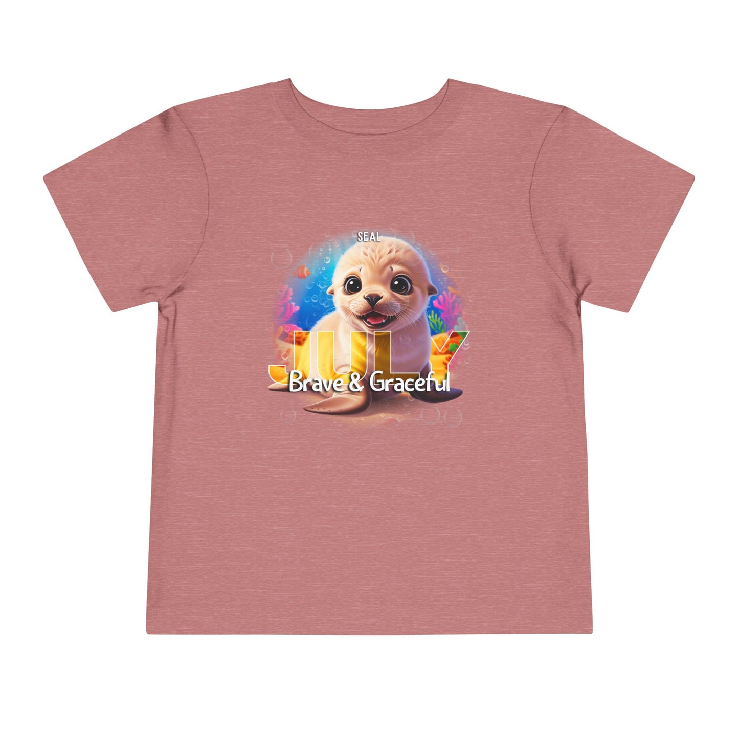 Kids birth month tshirt featuring a cute seal with Brave and Graceful text on a pink shirt