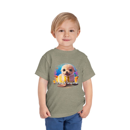 Toddler wearing kids birth month tshirt featuring a cute animal design and the text Brave and Graceful