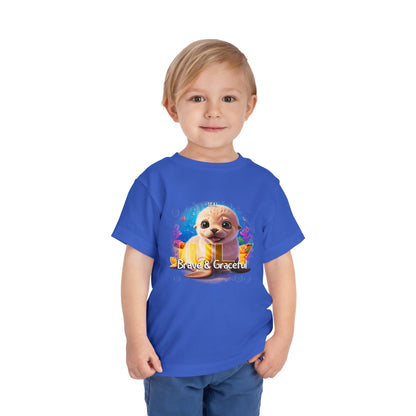 Child wearing blue kids birth month tshirt with a cute seal and Brave & Graceful text design