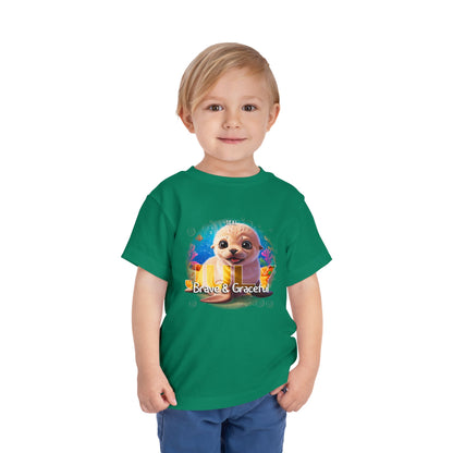 Child wearing green kids birth month tshirt with a cute seal and text Brave & Graceful