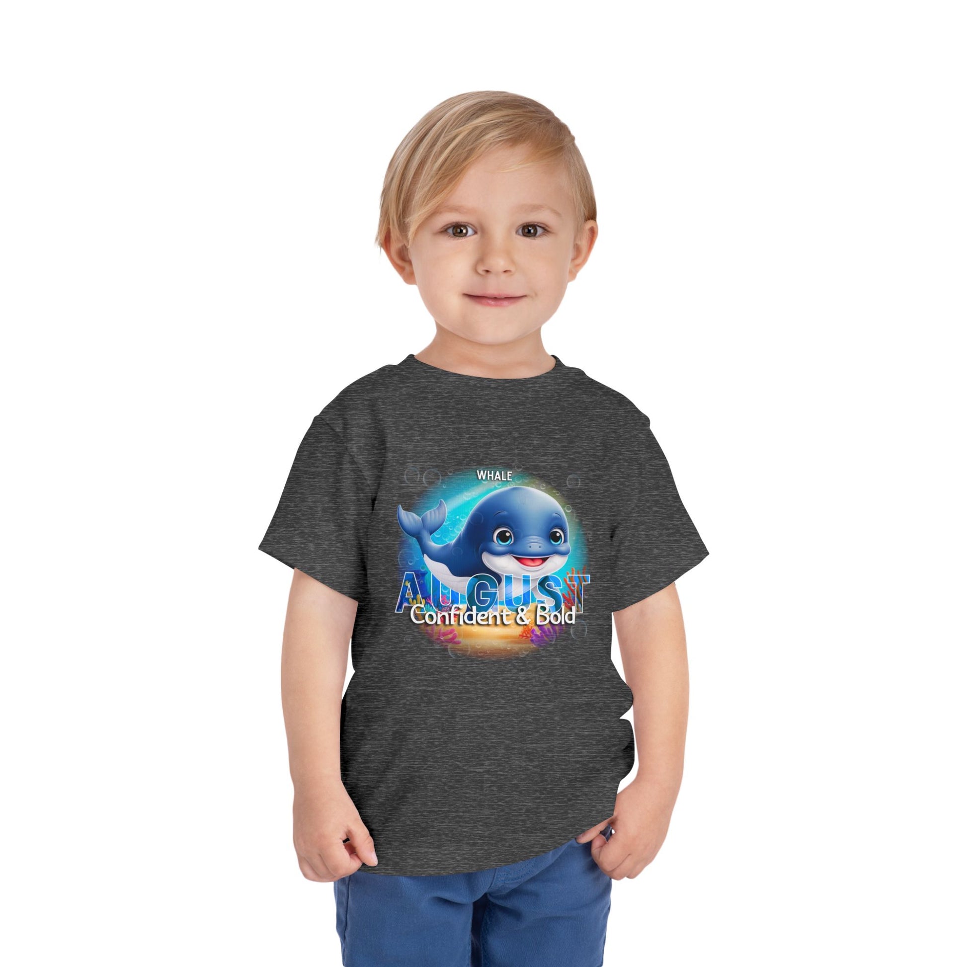 Toddler wearing a kids birth month tshirt with August whale design and confident text 