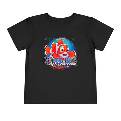 Black kids birth month tshirt featuring a colorful clownfish with December and lively courageous text
