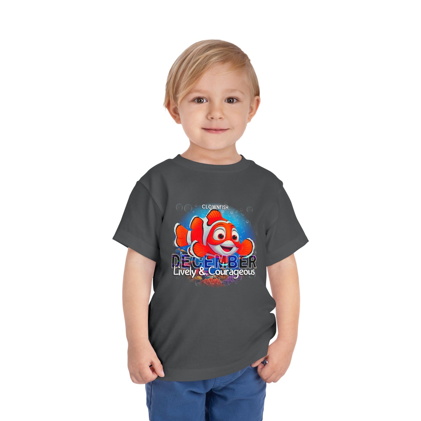 Child wearing kids birth month tshirt with colorful clownfish and December text design