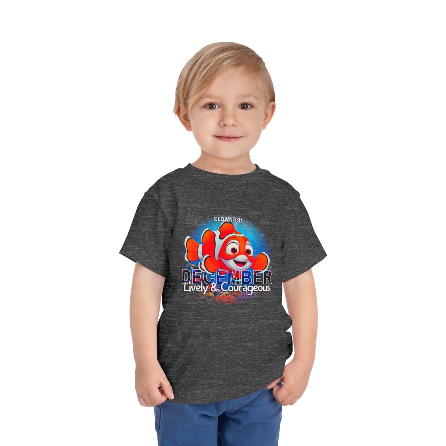 Kids birth month tshirt with December clownfish design worn by young boy