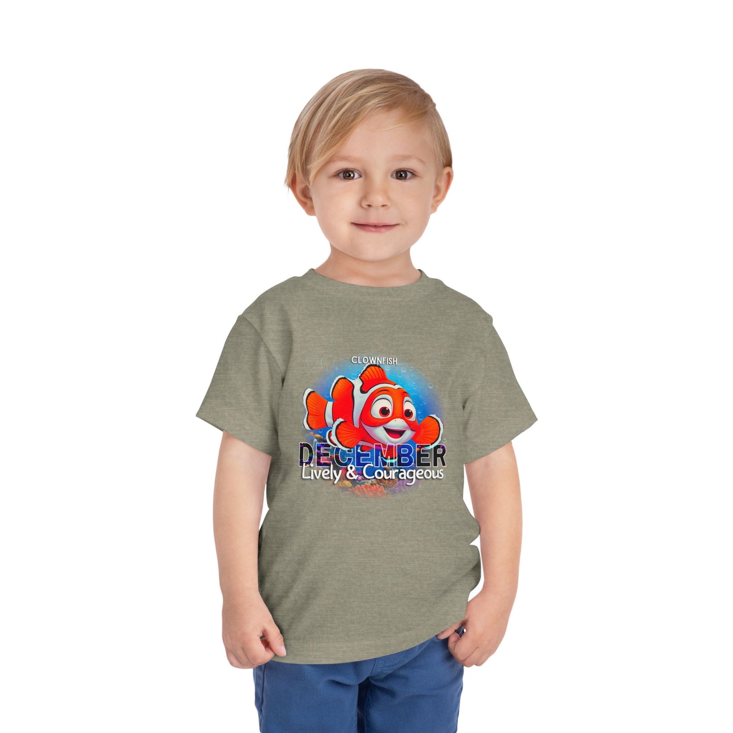 Toddler wearing kids birth month tshirt with colorful clownfish and December design