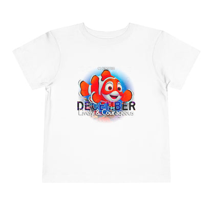 White kids birth month tshirt with clownfish graphic and December text lively and courageous design