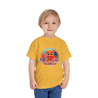 Young boy wearing a yellow kids birth month tshirt with colorful octopus design and creative text