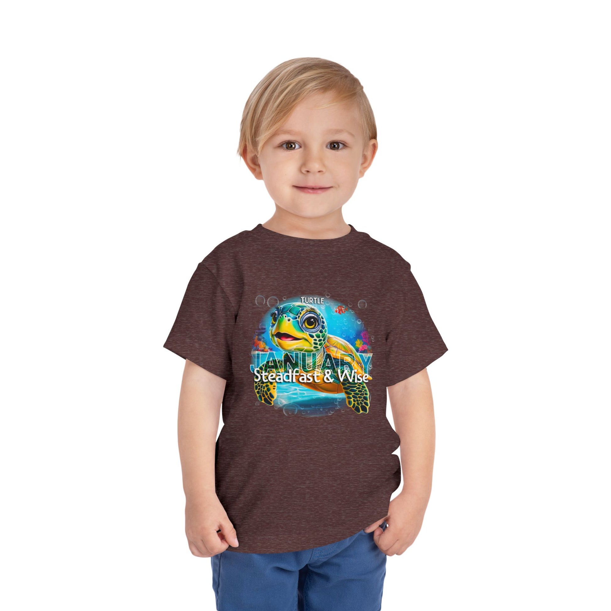 Toddler wearing  kids birth month tshirt with colorful January turtle design
