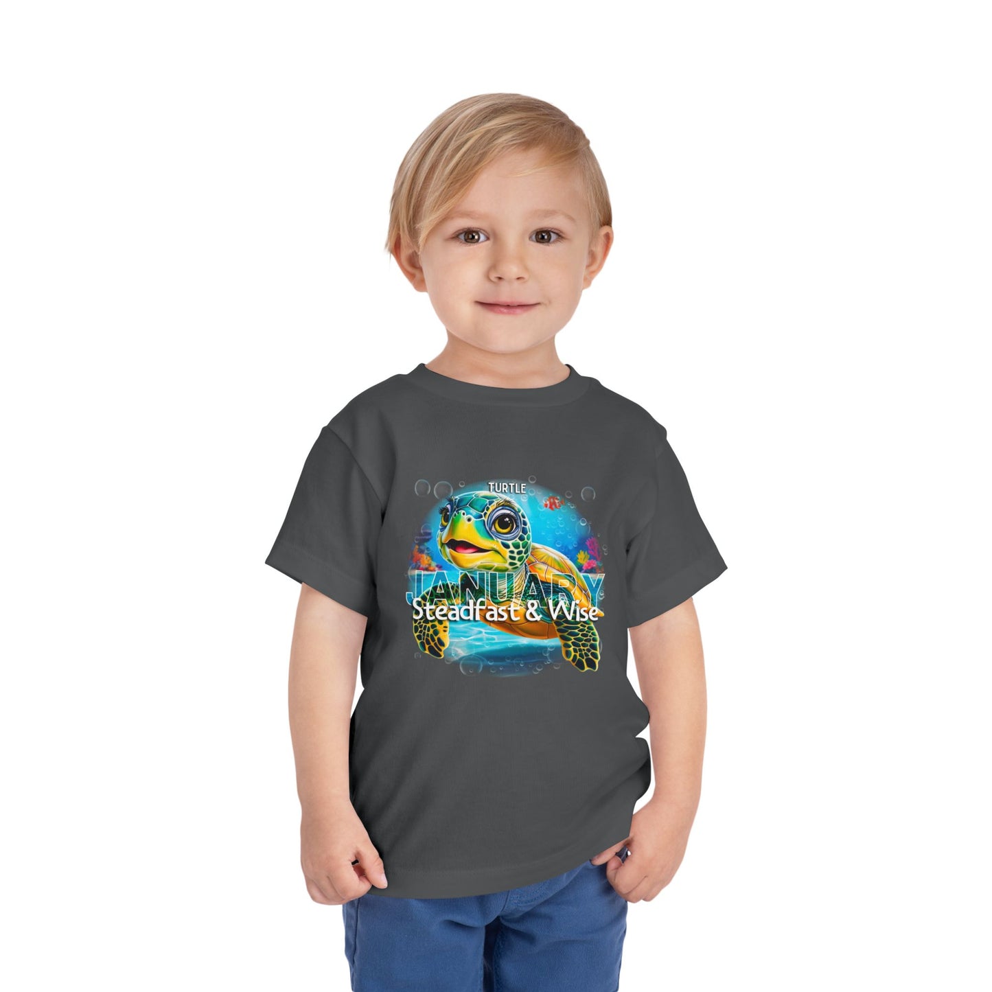 Child wearing kids birth month tshirt with colorful January turtle design