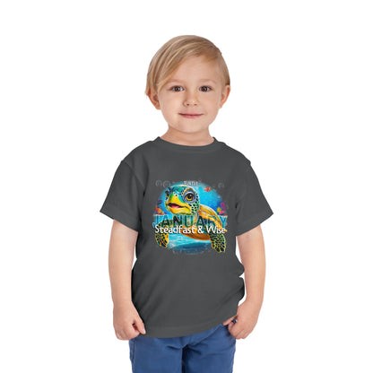 Child wearing kids birth month tshirt with colorful January turtle design