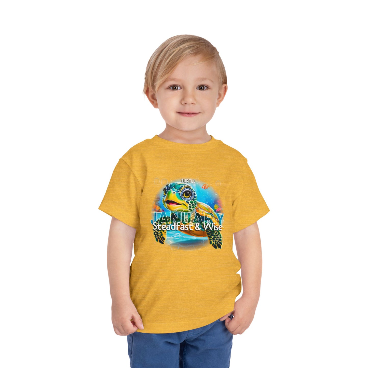 Child wearing yellow kids birth month tshirt with a colorful January turtle design