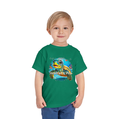 Child wearing green kids birth month tshirt with colorful turtle design for January