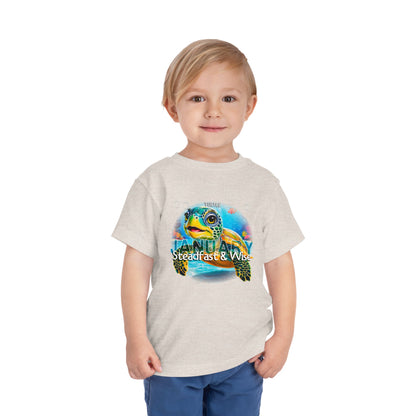 Child wearing kids birth month tshirt featuring a colorful turtle design and January text
