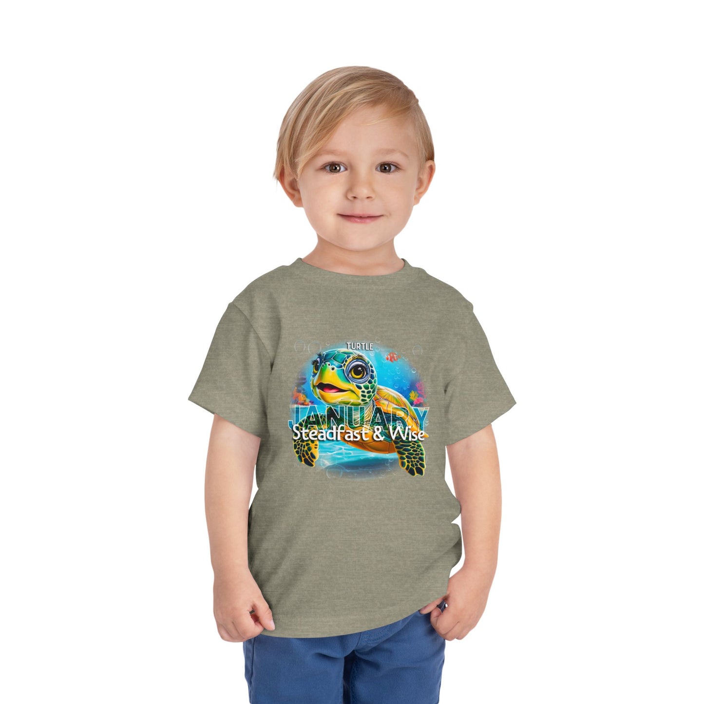 Toddler wearing kids birth month tshirt with colorful turtle design for January