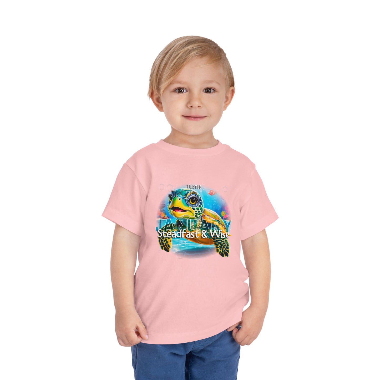 Child wearing a pink kids birth month tshirt with a colorful turtle graphic and January text