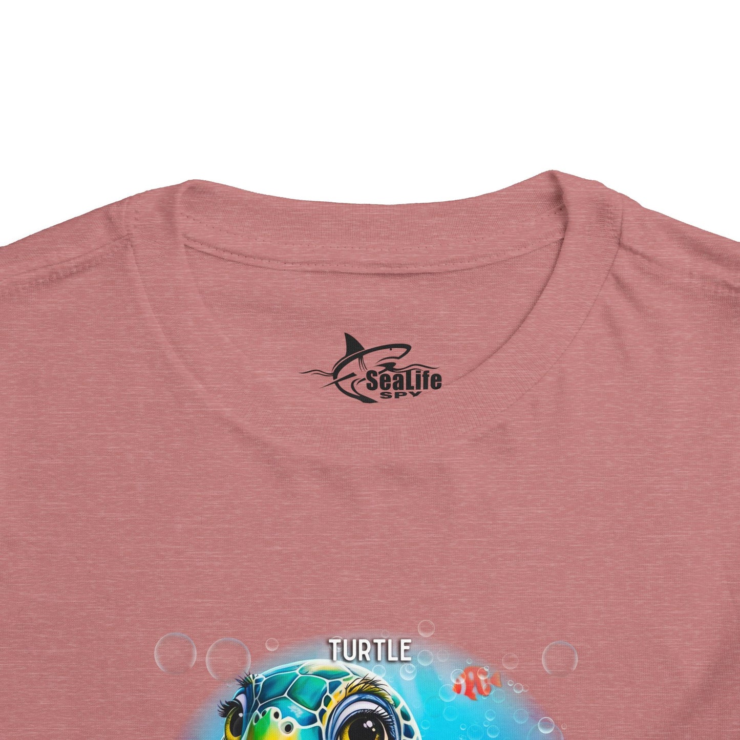 Kids birth month tshirt in pink featuring a colorful turtle design with bubbles