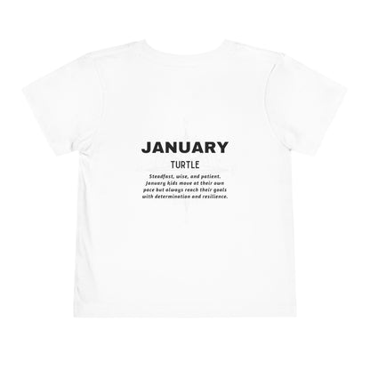 White kids birth month tshirt featuring January design with turtle and motivational text