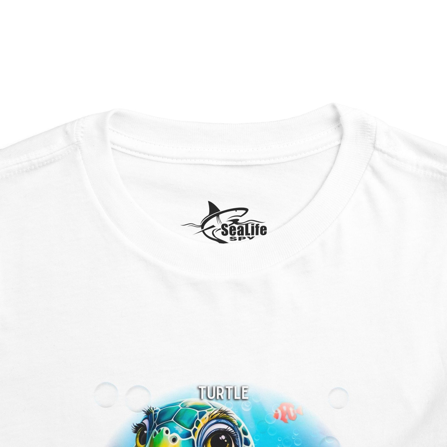 White kids birth month tshirt featuring a colorful turtle underwater design