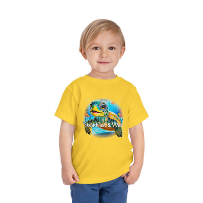Child wearing yellow kids birth month tshirt with turtle design for January 