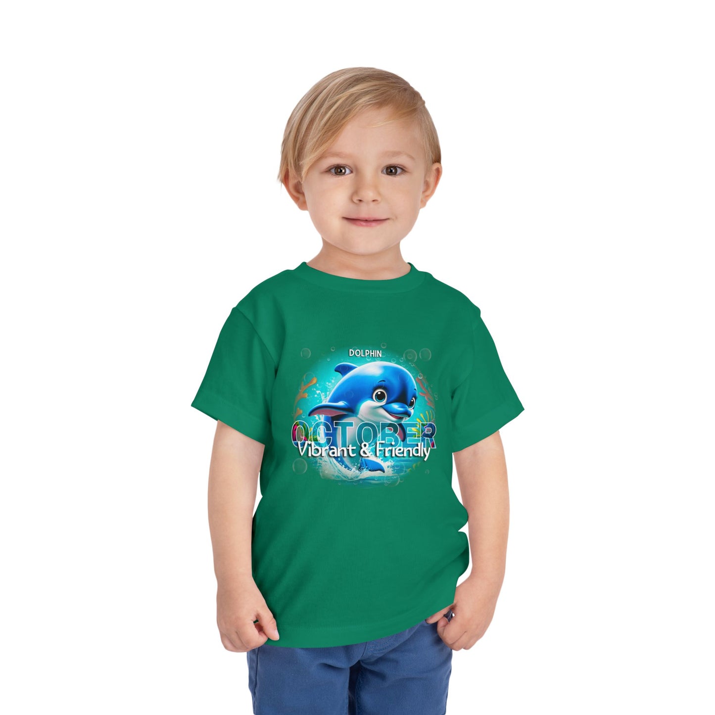 Child wearing green kids birth month tshirt with dolphin October design and vibrant friendly theme