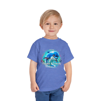 Kids birth month tshirt October with vibrant dolphin design worn by a smiling child