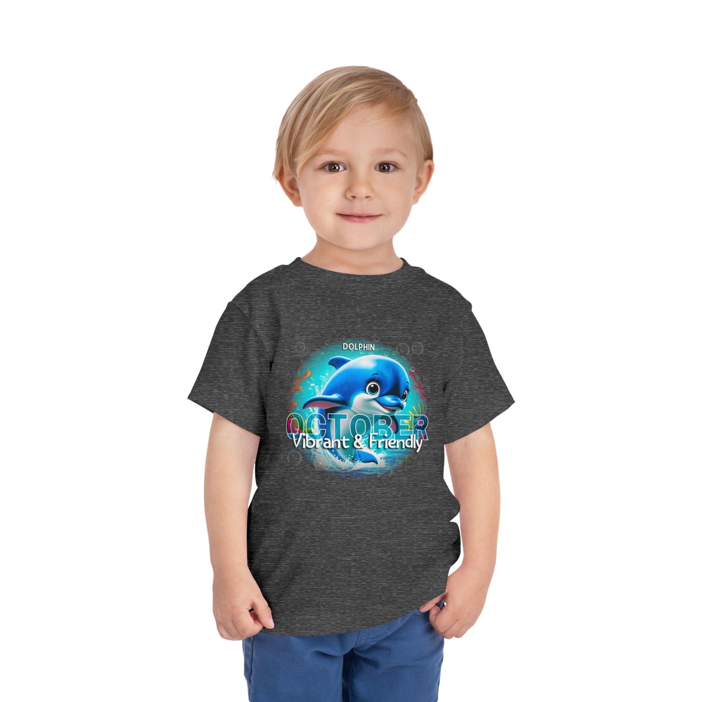 Toddler wearing a kids birth month tshirt with October dolphin design in dark gray