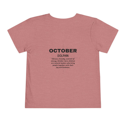 October kids birth month tshirt in pink with dolphin design and positive traits description