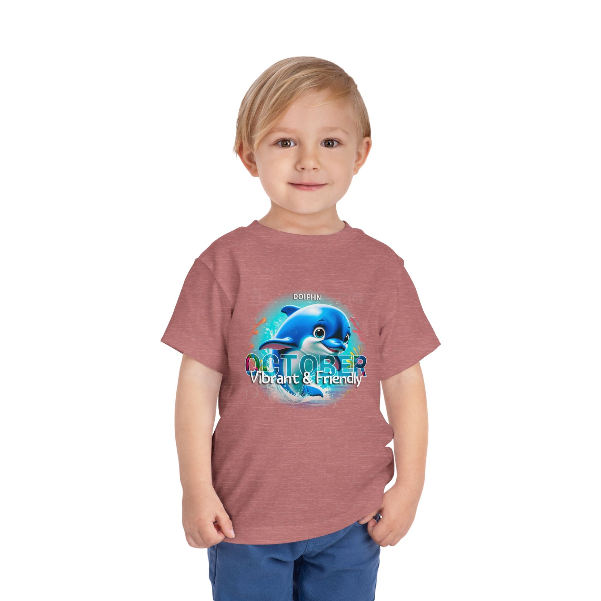 Toddler wearing October kids birth month tshirt with dolphin design vibrant and friendly print