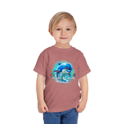 Toddler wearing October kids birth month tshirt with dolphin design vibrant and friendly print