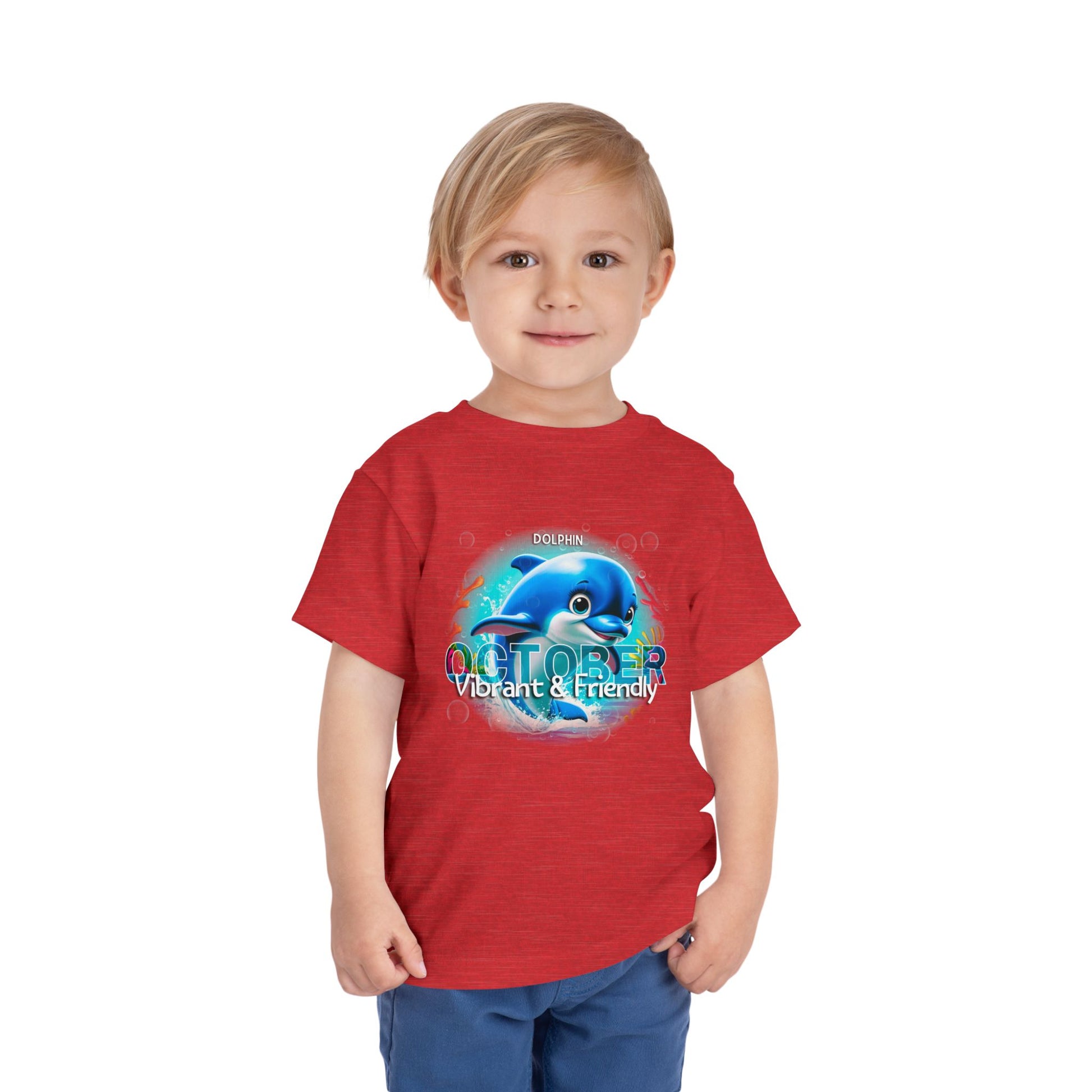 Child wearing red kids birth month tshirt with October dolphin design 