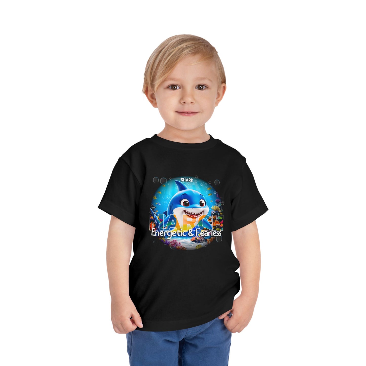 Toddler wearing black kids birth month tshirt with shark March design Energetic and Fearless
