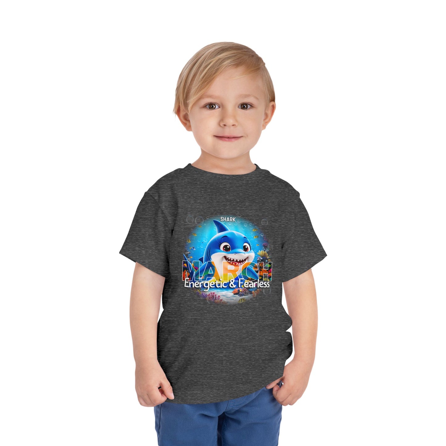 Kids birth month tshirt featuring March design with energetic shark graphic on dark gray fabric