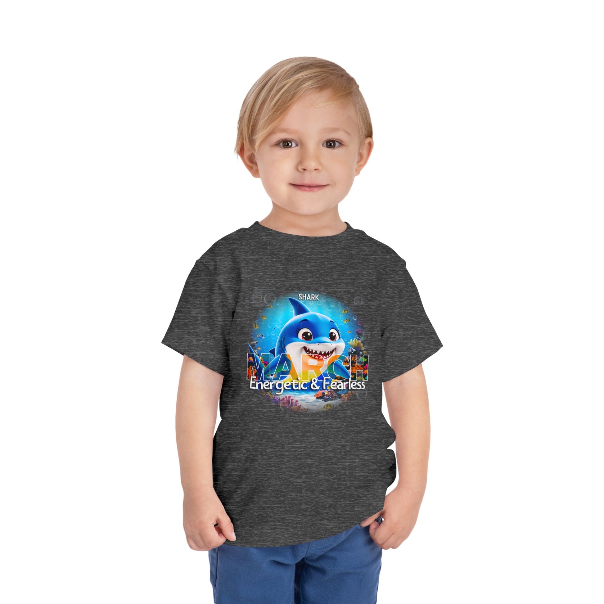 Kids birth month tshirt featuring March design with energetic shark graphic on dark gray fabric