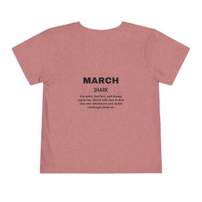 Kids birth month tshirt in pink featuring March shark design and descriptive text