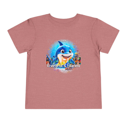 Kids birth month tshirt with March design featuring a cheerful blue shark and text Energetic and Fearless