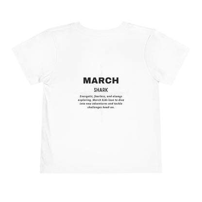 White kids birth month tshirt with March shark design and motivational text on the back