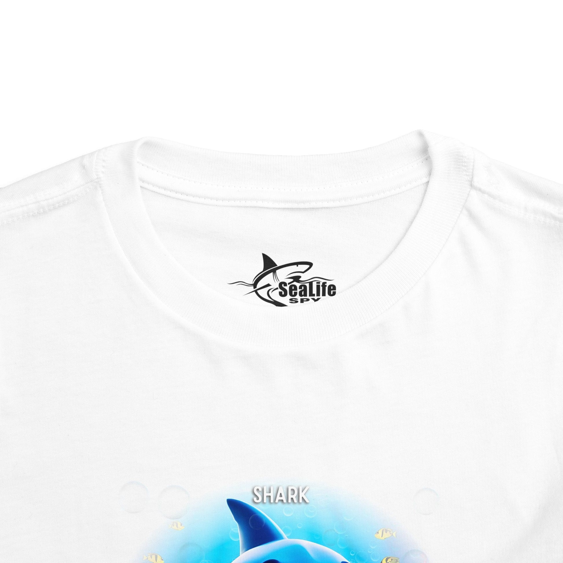 White kids birth month tshirt featuring a colorful shark design